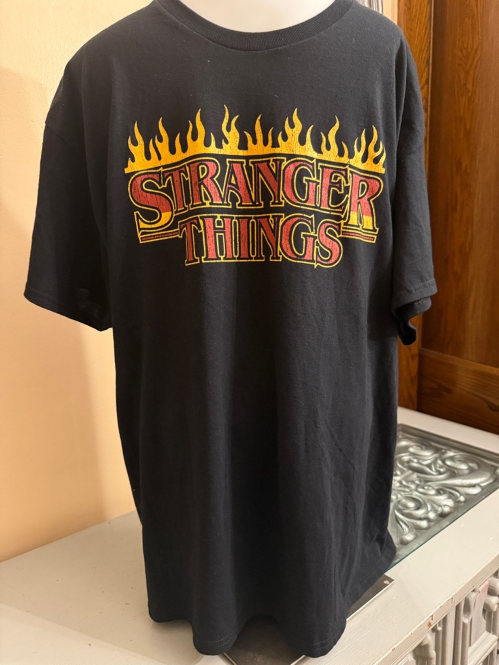 Netflix Stranger Things Black T‑Shirt with Red and Yellow Flame Logo